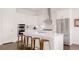 Stylish kitchen featuring a large island, modern appliances and bar stool seating at 22364 E Bailey Pl, Aurora, CO 80016
