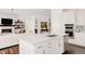 Kitchen view featuring an island, living area, and stainless steel appliances at 22364 E Bailey Pl, Aurora, CO 80016