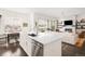 Open-concept living area with fireplace, dining space, and sliding glass doors at 22364 E Bailey Pl, Aurora, CO 80016