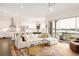 Spacious living room leading to a modern kitchen with stainless steel appliances and dining space at 22364 E Bailey Pl, Aurora, CO 80016