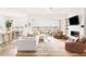 Bright living room featuring a fireplace and a large glass door to the outdoor patio at 22364 E Bailey Pl, Aurora, CO 80016
