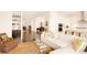 Bright and open floor plan with combined living room, kitchen, and dining area at 22364 E Bailey Pl, Aurora, CO 80016