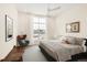 Relaxing main bedroom with natural light, chair, and decor pieces at 22364 E Bailey Pl, Aurora, CO 80016