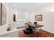 Comfortable home office space with a desk, seating, and ample natural light at 22364 E Bailey Pl, Aurora, CO 80016