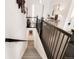 Hallway staircase with modern railing and decor at 22364 E Bailey Pl, Aurora, CO 80016