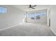 Spacious bedroom featuring plush carpet, abundant natural light, and a modern ceiling fan at 1601 Venice Ln, Longmont, CO 80503