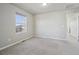 Bright bedroom featuring neutral carpet and a view of the neighborhood at 1601 Venice Ln, Longmont, CO 80503