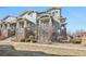 Charming exterior elevation with stone accents, showcasing curb appeal and architectural detail at 1601 Venice Ln, Longmont, CO 80503