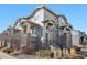 Three-story condo featuring attractive architecture and landscaping at 1601 Venice Ln, Longmont, CO 80503