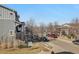 Street view with homes on either side of the road, with several parked cars at 1601 Venice Ln, Longmont, CO 80503