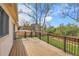 A spacious outdoor deck overlooks a fenced yard with lush green grass at 11203 W Dorado Ave, Littleton, CO 80127