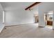 Open-concept living space with vaulted ceilings, ceiling fan, and plenty of natural light at 11203 W Dorado Ave, Littleton, CO 80127