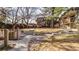 Expansive backyard showcasing lush greenery and a stone pathway for outdoor enjoyment at 1525 S Holly St # 106, Denver, CO 80222