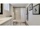 Updated bathroom featuring a shower-tub combo, sleek vanity, and modern fixtures at 1525 S Holly St # 106, Denver, CO 80222