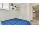 Comfortable bedroom features carpeted floors, a closet, and a queen-size bed at 1525 S Holly St # 106, Denver, CO 80222