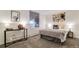 Cozy bedroom with neutral tones, soft lighting, and a comfortable queen-sized bed at 1525 S Holly St # 106, Denver, CO 80222
