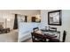 Cozy dining area adjacent to the living room with stylish decor at 1525 S Holly St # 106, Denver, CO 80222