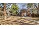 Charming brick building with a well-maintained lawn surrounded by mature trees at 1525 S Holly St # 106, Denver, CO 80222