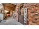 Charming brick entrance with a decorative welcome sign and covered porch area at 1525 S Holly St # 106, Denver, CO 80222