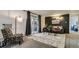 Inviting living room featuring a cozy rug, statement lighting and access to an outdoor patio at 1525 S Holly St # 106, Denver, CO 80222