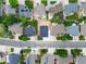Aerial view of the neighborhood showcasing manicured lawns and tree-lined streets at 5550 Wetlands Dr, Longmont, CO 80504