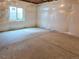 Unfinished basement features a single window and plastic vapor barrier at 5550 Wetlands Dr, Longmont, CO 80504