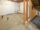 Unfinished basement with concrete floor, exposed framing, and plastic-covered walls at 5550 Wetlands Dr, Longmont, CO 80504