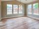 The dining room has wood floors, neutral walls, and many windows that provide natural light at 5550 Wetlands Dr, Longmont, CO 80504