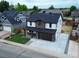 Beautiful two-story home with a well-manicured lawn and inviting front porch at 5550 Wetlands Dr, Longmont, CO 80504