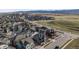 Aerial view of a residential neighborhood surrounded by open space and mountains, showcasing a well-planned community at 9694 Meeker St, Littleton, CO 80125