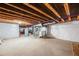 Unfinished basement offering open space and visible utilities, ideal for customization and storage at 9694 Meeker St, Littleton, CO 80125