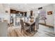 Modern eat-in kitchen featuring stainless steel appliances, granite countertops, and stylish pendant lighting at 9694 Meeker St, Littleton, CO 80125
