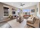 Spacious living room featuring hardwood floors, abundant natural light, and a comfortable seating area at 9694 Meeker St, Littleton, CO 80125