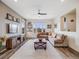 Spacious living room featuring hardwood floors, abundant natural light, and a comfortable seating area at 9694 Meeker St, Littleton, CO 80125