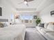 Bright main bedroom with scenic views, a comfortable sitting area, and modern furnishings for a luxurious retreat at 9694 Meeker St, Littleton, CO 80125