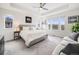 Spacious main bedroom with ample natural light, plush carpeting, and a calming neutral color palette at 9694 Meeker St, Littleton, CO 80125