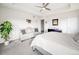 Inviting main bedroom featuring a cozy sitting area, soft carpet, and serene decor for relaxation at 9694 Meeker St, Littleton, CO 80125