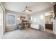 Home office featuring a ceiling fan, large desk, and a bright window for comfortable workspace at 9694 Meeker St, Littleton, CO 80125