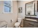 Charming powder room features a modern vanity, decorative mirror, and stylish fixtures for a touch of elegance at 9694 Meeker St, Littleton, CO 80125