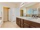 Bathroom vanity with double sinks and a large mirror at 162 N Eaton Park St, Aurora, CO 80018