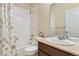 Bathroom with a tub/shower combo, single vanity, and neutral walls at 162 N Eaton Park St, Aurora, CO 80018