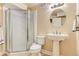 Bathroom with a glass enclosed shower and pedestal sink with towel racks at 162 N Eaton Park St, Aurora, CO 80018