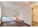 Bedroom featuring neutral walls, a white dresser, and an oriental rug at 162 N Eaton Park St, Aurora, CO 80018