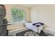 Bedroom featuring a window, rug, and neutral paint at 162 N Eaton Park St, Aurora, CO 80018