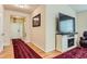 Home entryway with hardwood floors, decorative rug, and views into the living area at 162 N Eaton Park St, Aurora, CO 80018