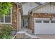 Welcoming entryway with stone accents, a storm door, and an inviting front door at 162 N Eaton Park St, Aurora, CO 80018