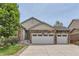 Charming home exterior with a three car garage, stone accents, and well-maintained landscaping at 162 N Eaton Park St, Aurora, CO 80018