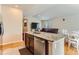 Open-concept kitchen featuring stainless steel appliances and a breakfast bar at 162 N Eaton Park St, Aurora, CO 80018