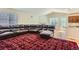 Open-concept living area featuring hardwood floors, a fireplace, and an entertainment area at 162 N Eaton Park St, Aurora, CO 80018