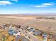 An aerial view showcasing a community near open fields and mountains, offering a blend of nature and neighborhood living at 7131 Shavano Cir, Frederick, CO 80504